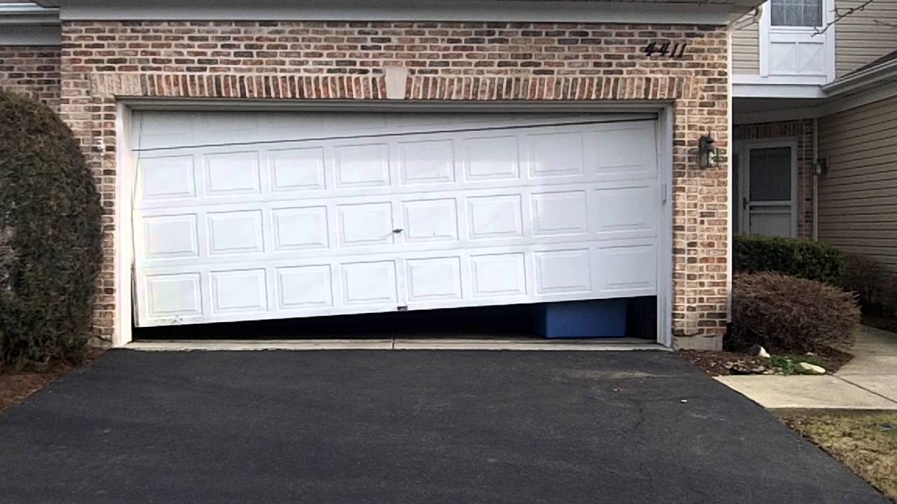 crooked-off-track-garage-door-broken-repair